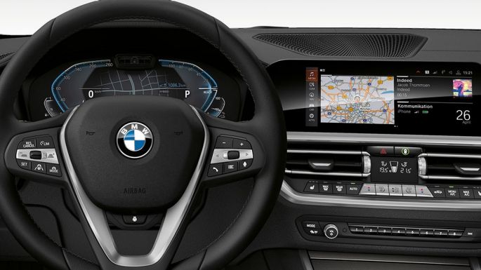 BMW 3 Series Sedan, 330e Cockpit. Detailed frontal view of the BMW 3 Series Sedan cockpit with i-specific display.