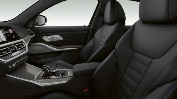 BMW 3 Series, sport seats. Close-up side view of the front row seats with black sport seats for driver and front passenger.