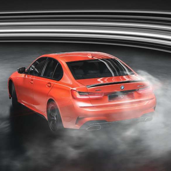 Side view BMW M340i xDrive Sedan BMW M340i xDrive Sedan G20 Sapphire Black metallic side view while driving