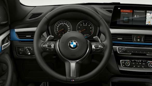 BMW X1, multifunctional steering wheel. BMW X1, interior with M Sport Package and M Sports steering.
