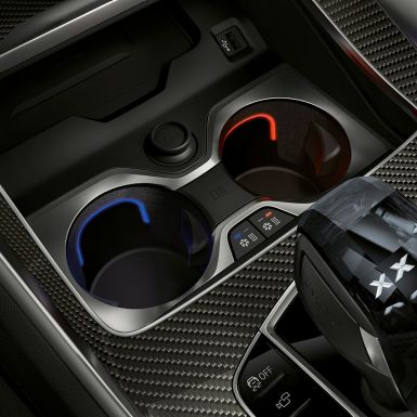 Temperature-controlled cupholder. Close-up of the BMW interior with focus on temperature-controlled cupholder.