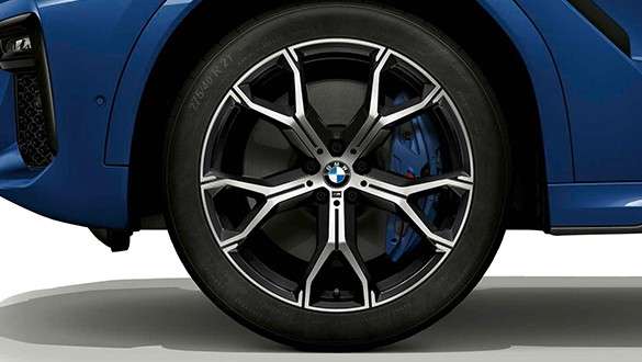 BMW X6 with focus on light alloy wheel. BMW X6 exterior with focus on light alloy wheel.