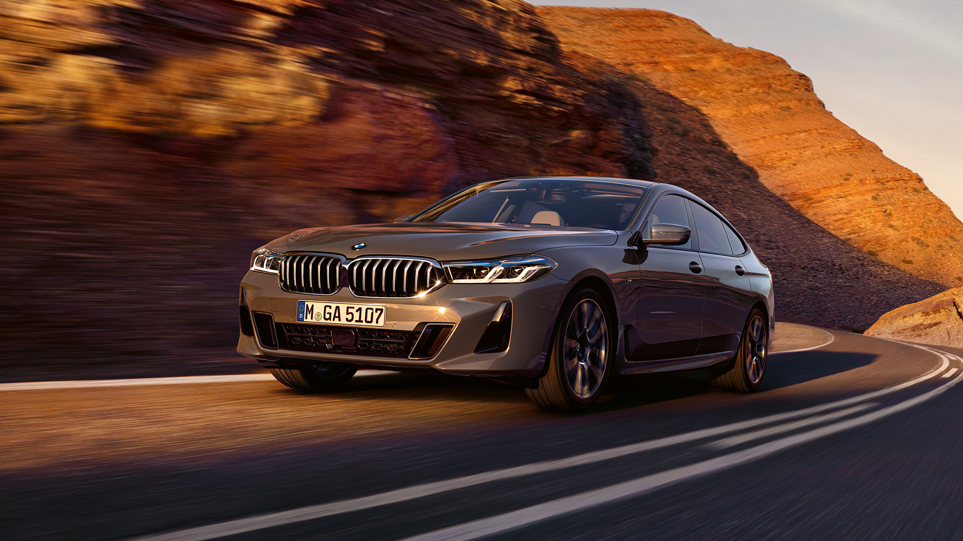 BMW 6 Series BMW 6 series 640i xDrive Bernina Grey in three-quarter front driving in front of landscape