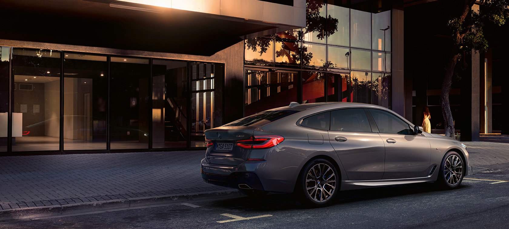 BMW 6 Series BMW 6 Series Bernina Grey side rear view parked in front of building