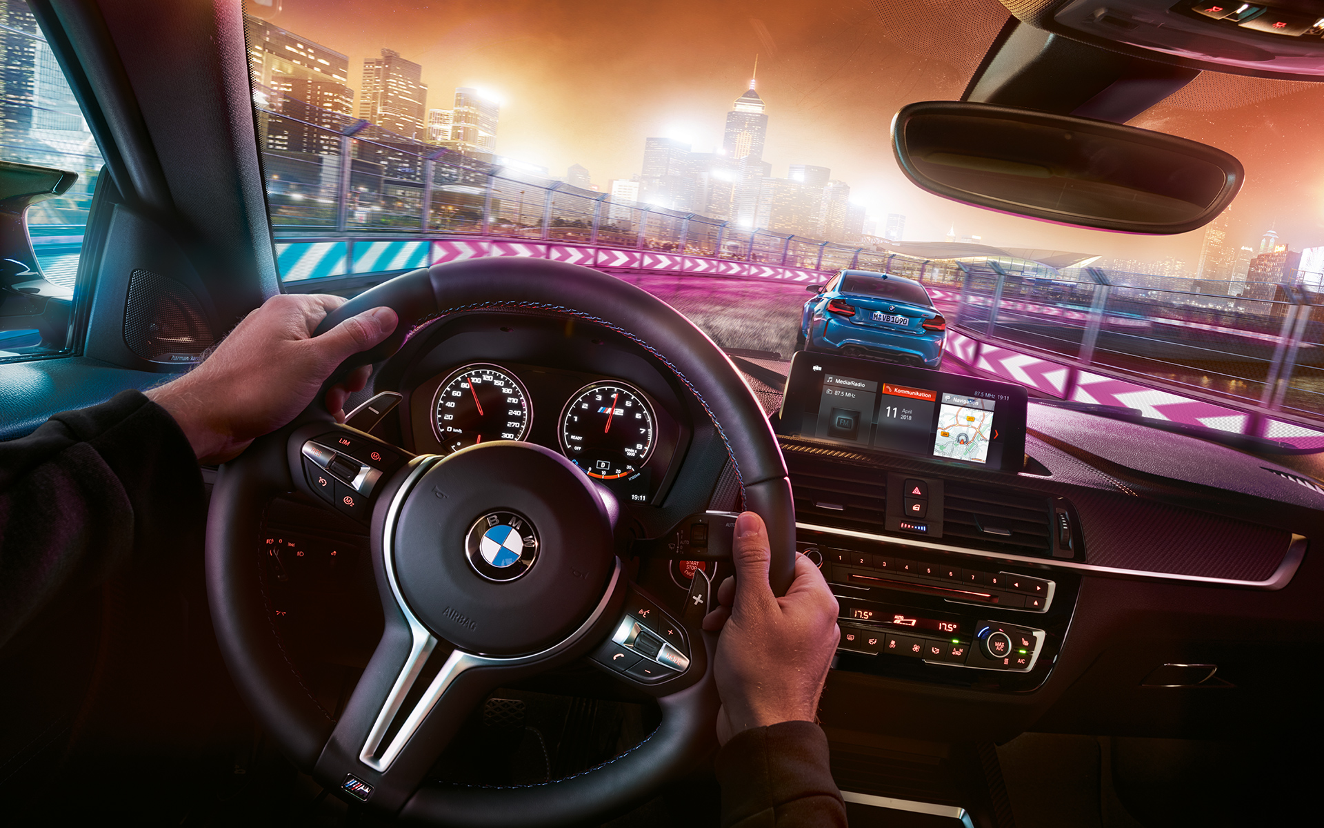 BMW M2 Competition cockpit Two BMW M2 Competition in racing situation at night, view from cockpit.