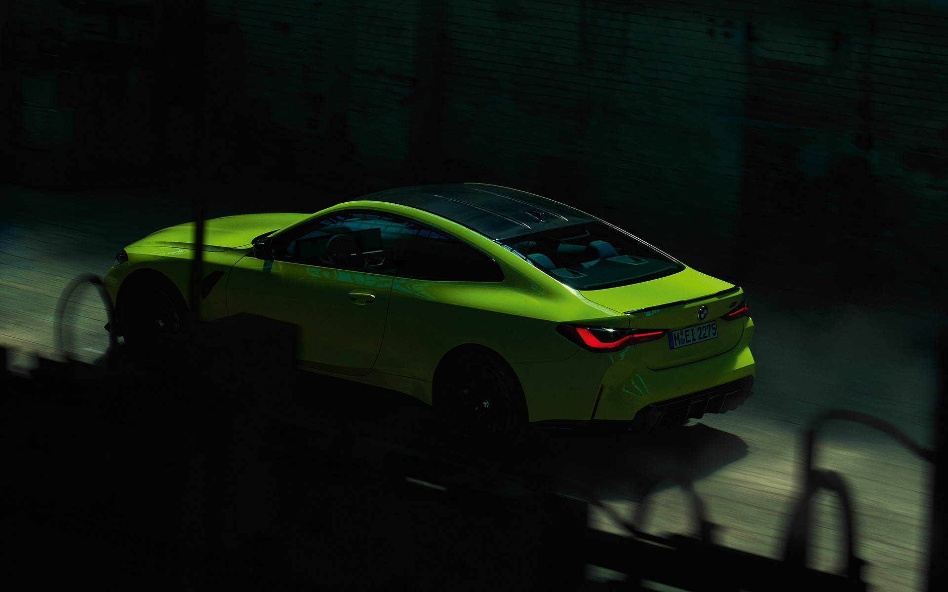 BMW M4 Competition Coupé with M xDrive Sao Paulo Yellow three-quarter rear view 
