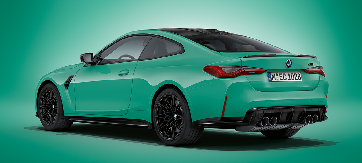 BMW M4 Competition Coupé with M xDrive three-quarter rear view standing BMW M4 Competition Coupé with M xDrive three-quarter rear view standing