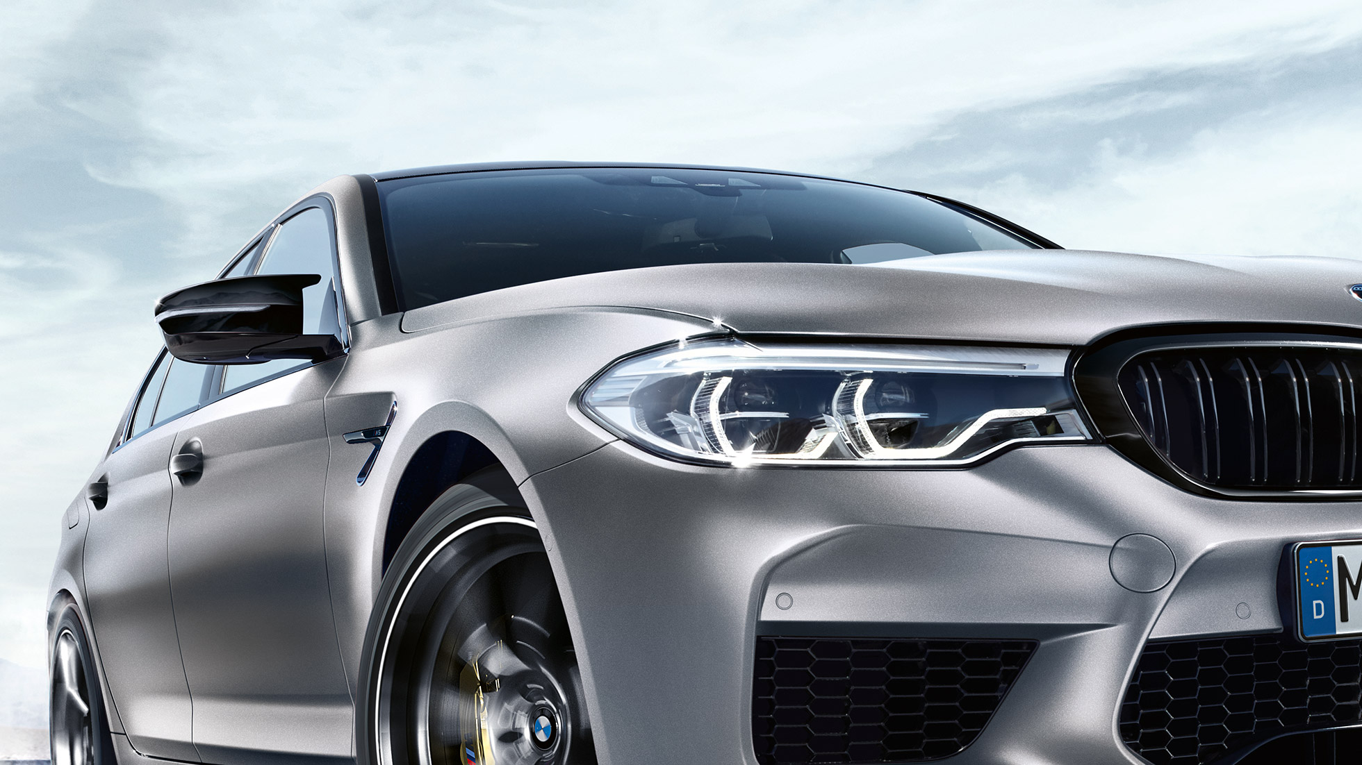 LED front headlights. BMW M5 three-quarter front shot with LED front headlights.