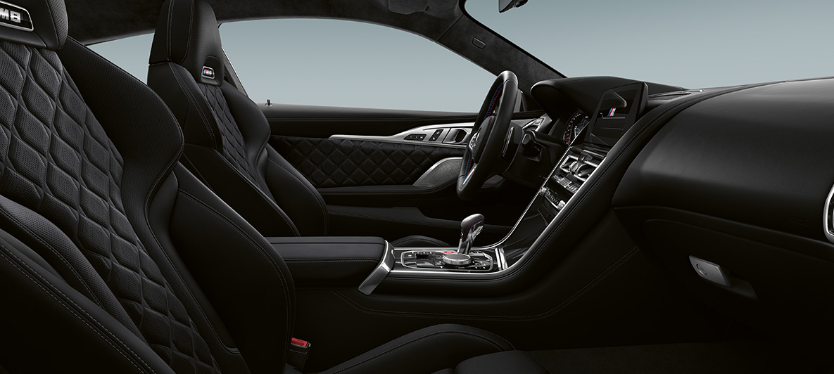 Full fine-grain leather 'Merino' | Black and BMW Individual interior trim Piano Finish Black. BMW M8 Coupé, interior in full fine-grain leather 'Merino' | Black and BMW Individual interior trim Piano Finish Black.
