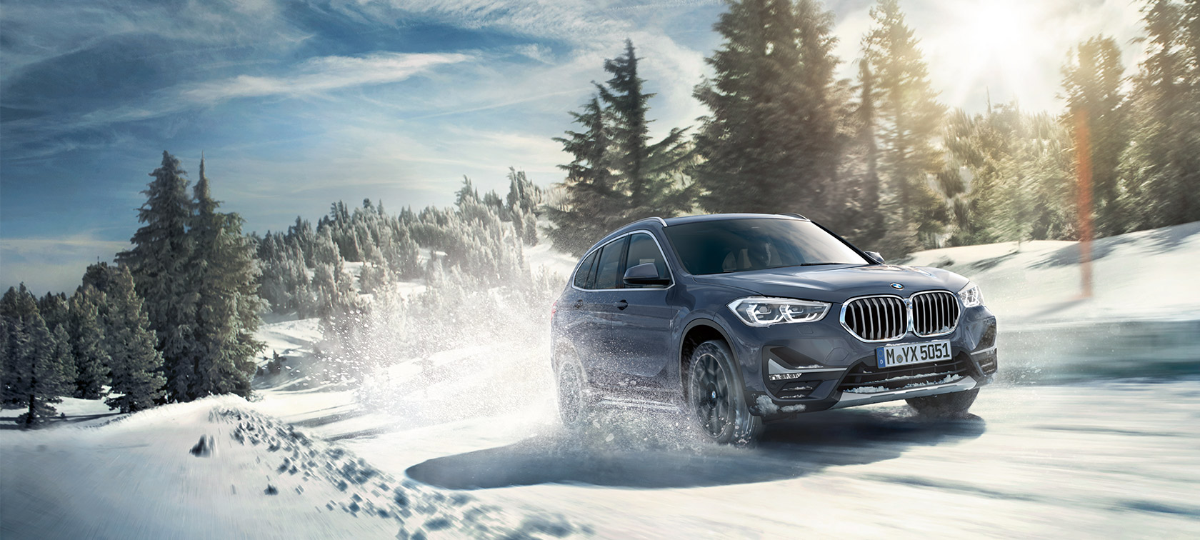 BMW X1 xDrive20i F48 LCI in BMW Individual Storm Baymetallic, driving in winter landscape BMW X1 xDrive20i F48 LCI in BMW Individual Storm Baymetallic, driving in winter landscape
