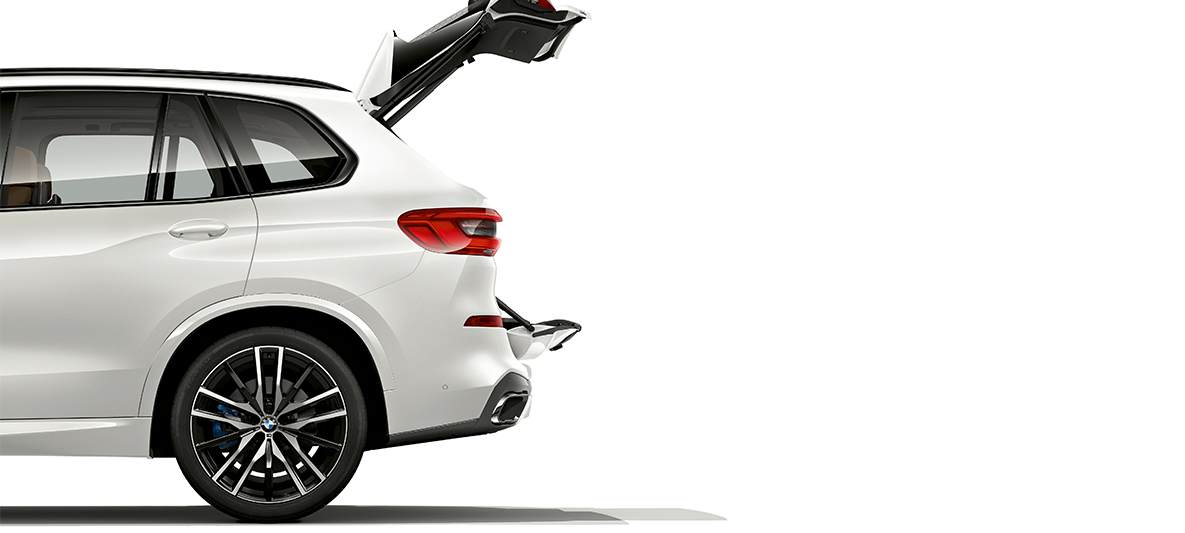 BMW X5 with opened tailgate Side view of the BMW X5, both tailgate sections are opened