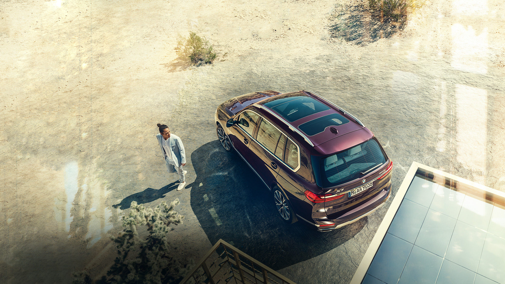 BMW Individual X7 xDrive40i, side perspective BMW X7 in Ametrin Metallic standing from the side perspective