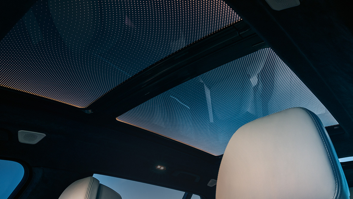 Ambient light View from the front row of seats up to the panorama glass roof framed by the orange ambient light