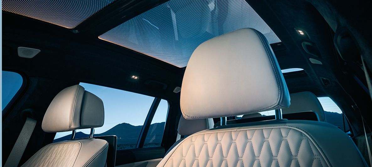 Ambient light View from the front row of seats up to the panorama glass roof framed by the orange ambient light