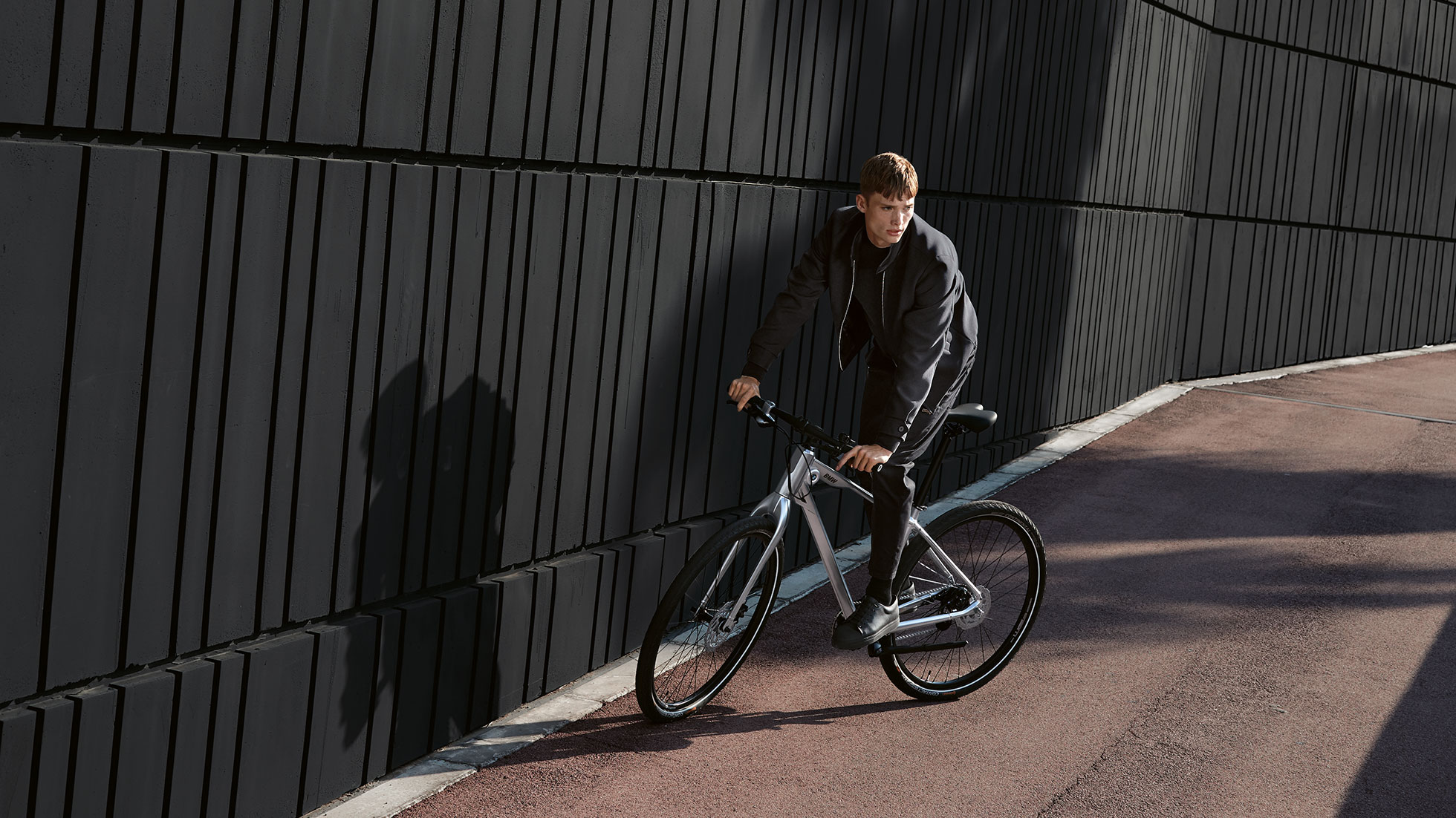 A man rides a curve on a BMW Cruise Bike.