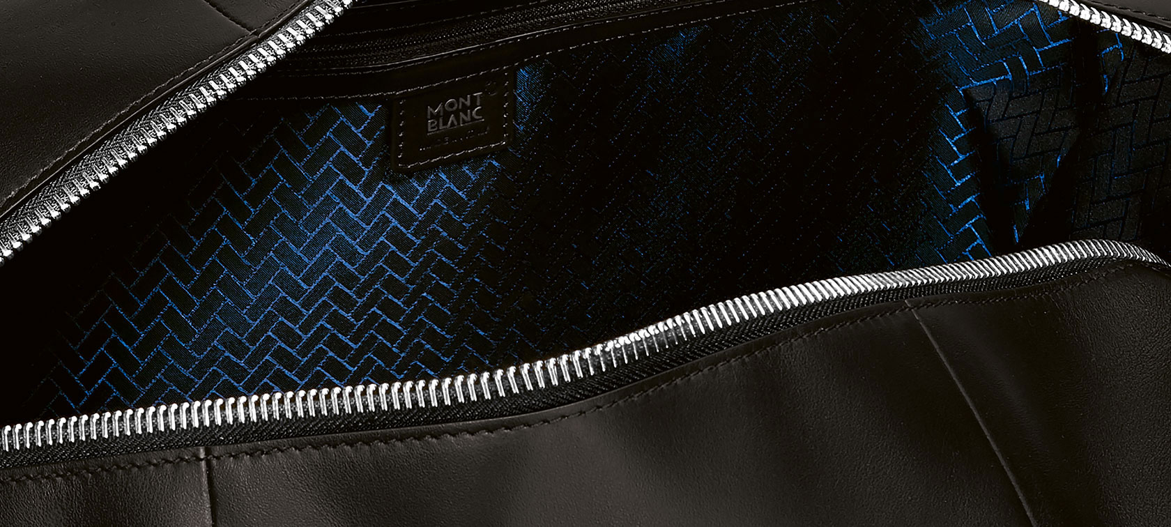 The picture is a close-up of the label of a Montblanc for BMW Duffle Bag.