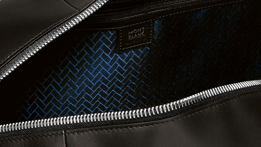 The picture is a close-up of the label of a Montblanc for BMW Duffle Bag.