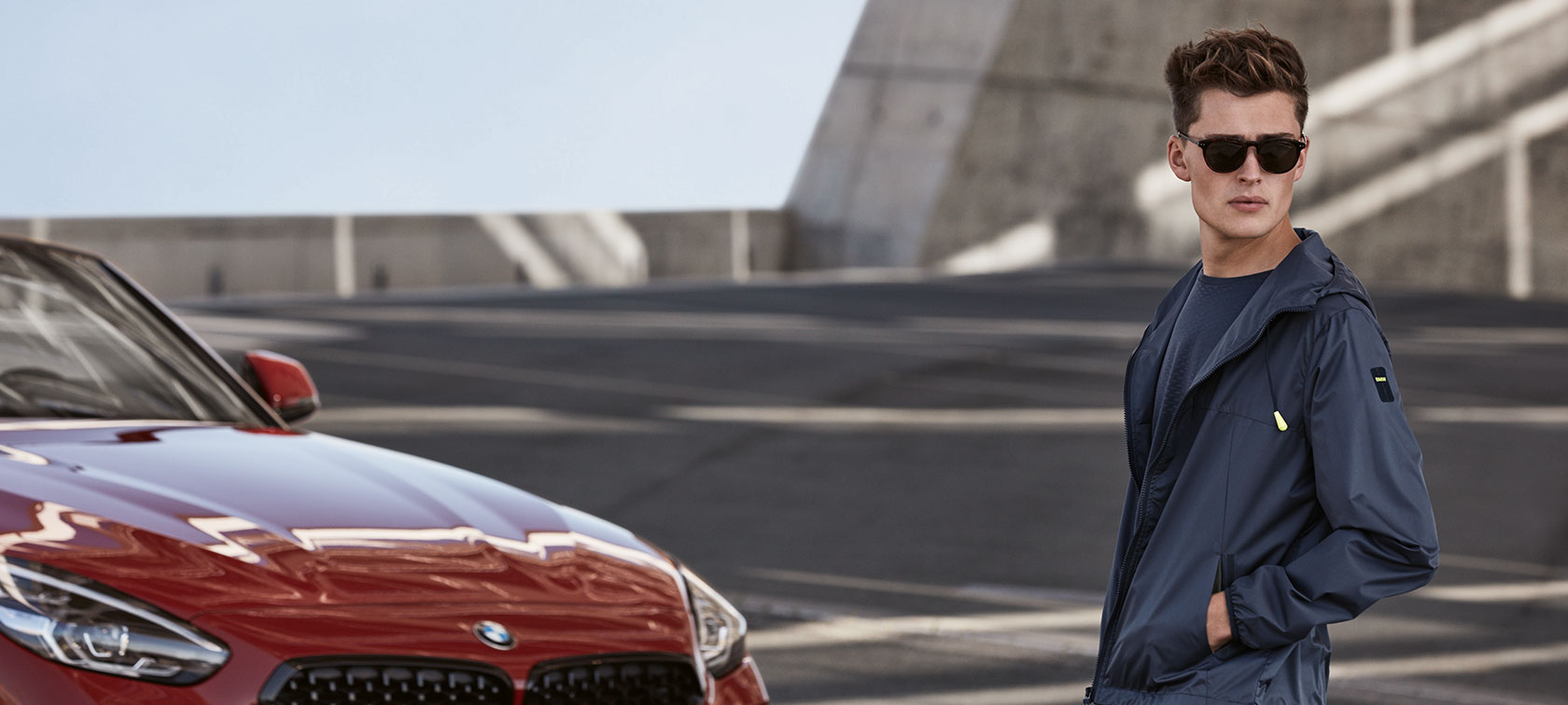 A male model makes a confident impression while wearing products from the BMW Collection. A male model makes a confident impression while wearing products from the BMW Collection.