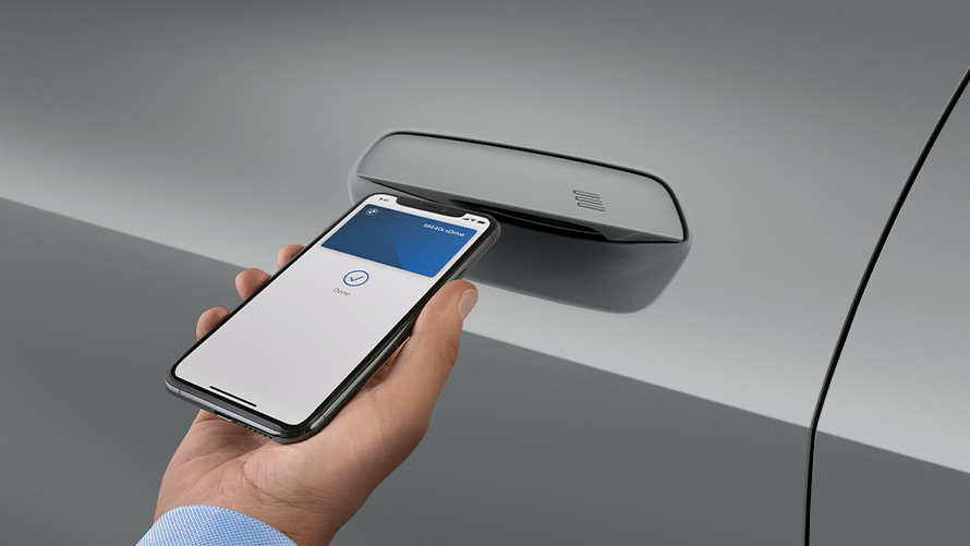 Smartphone in front of the car door to unlock