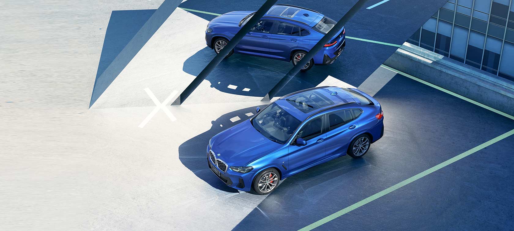The New BMW X4 Black Shadow Edition G02 Financial Services The New BMW X4 Black Shadow Edition G02 Financial Services Brooklyn Grey three-quarter rear view driving